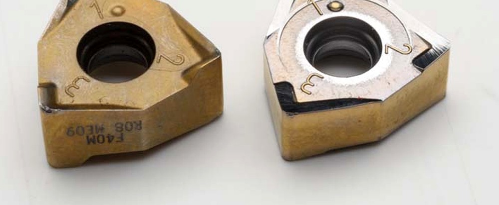 A worn carbide insert beside the same insert after regrinding — used tooling made usable again