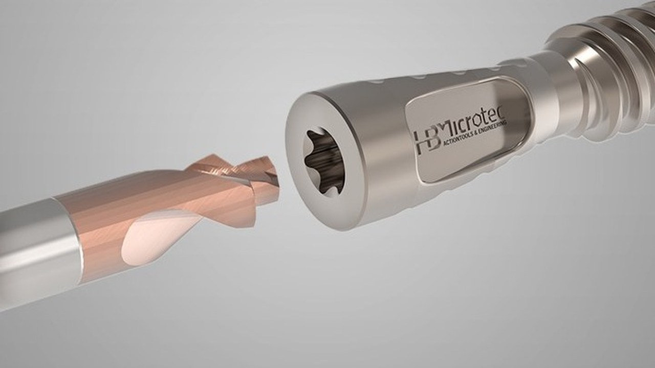 HB microtec Torx cutter alongside a bone screw head showing the six-lobe ISO 10664 socket it produces