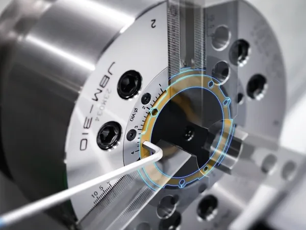 Samchully JBM-310 power chuck with its rotating boring sleeve highlighted and a hex key in place
